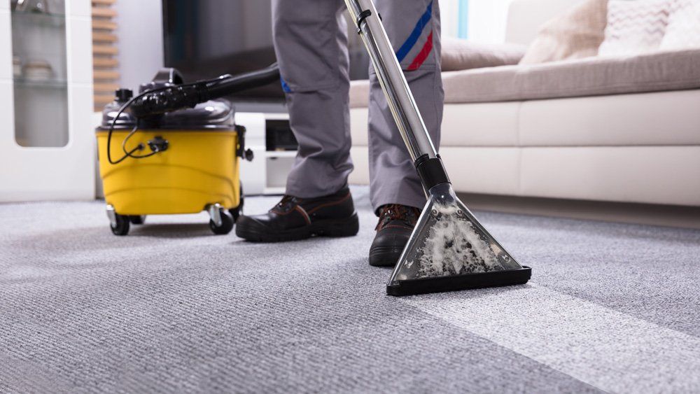 Vacuuming The Carpet — Valley, NY — Classic Carpet and Upholstery Cleaning Vacuuming The Carpet — Valley, NY — Classic Carpet and Upholstery Cleaning