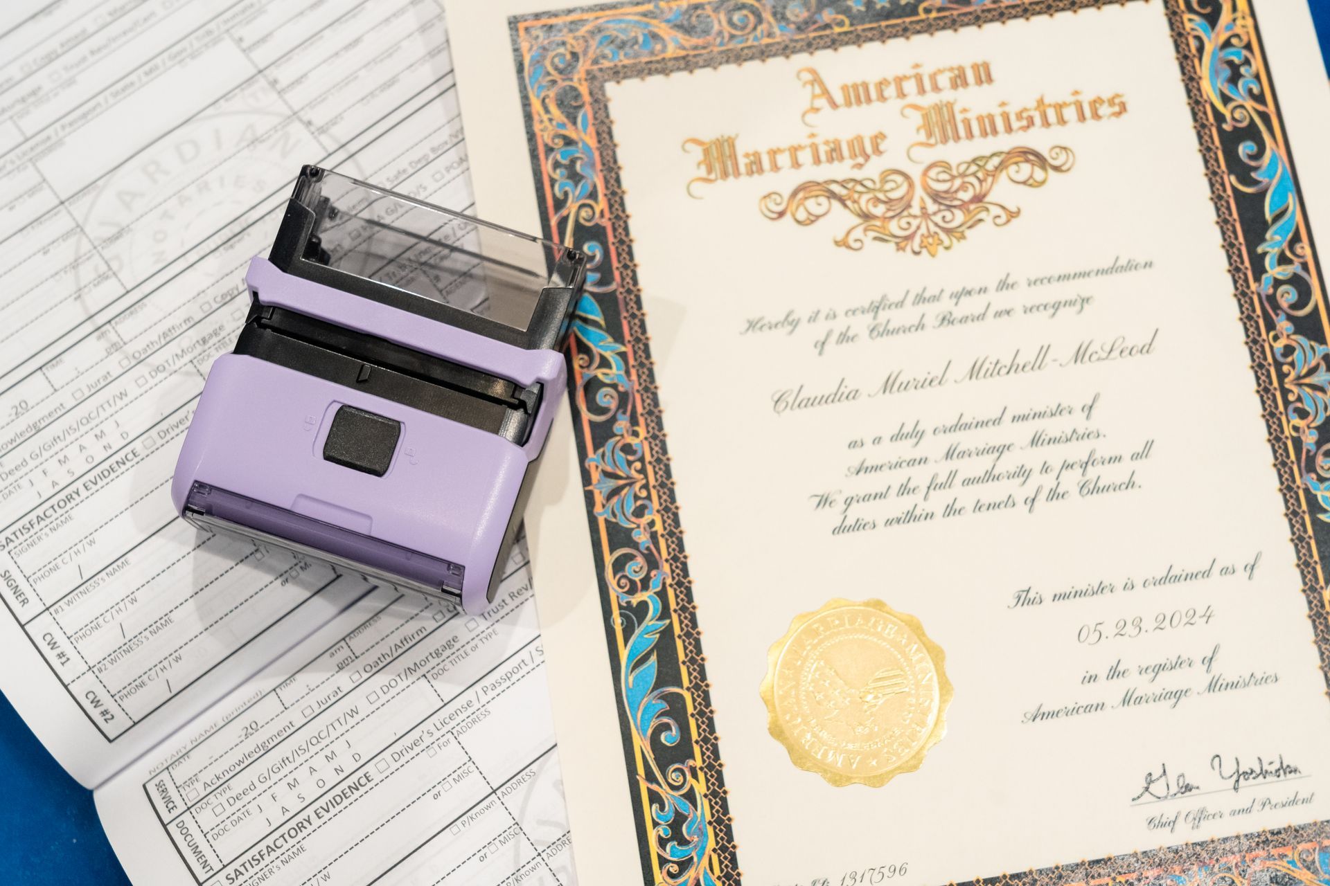 A public notary stamp is sitting on top of a piece of paper.