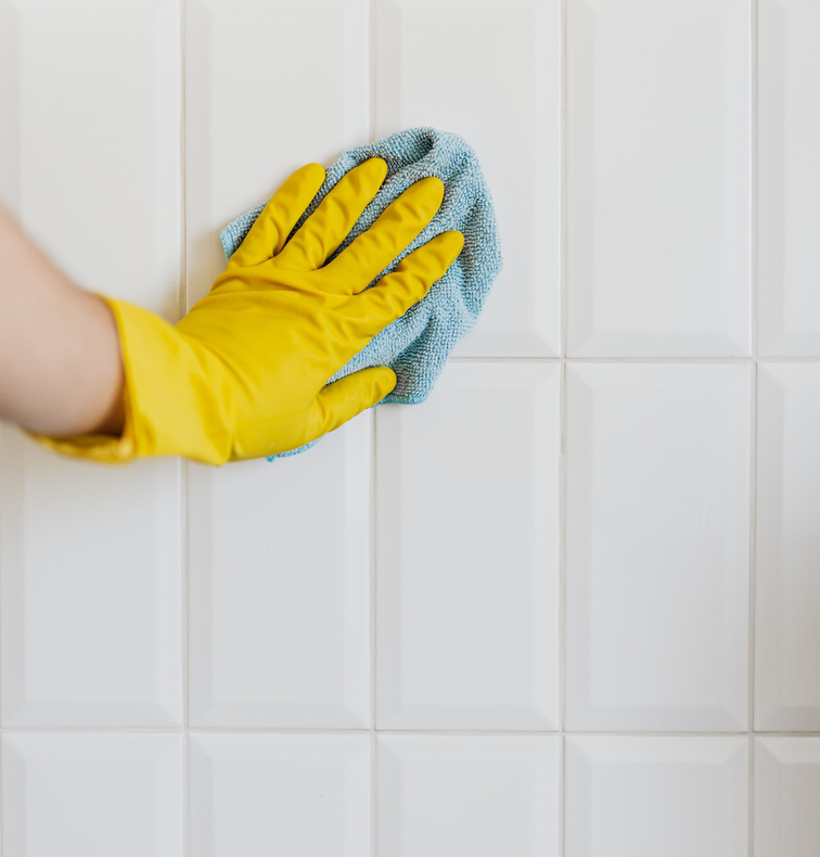 Gloved hand washing tile