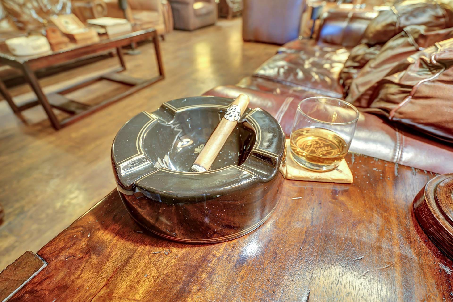Cigar on a polished minimalist ashtray