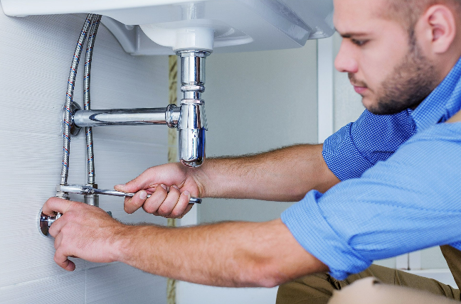 Licensed Maintenance Plumber Checking For Leaks In a Brisbane Home