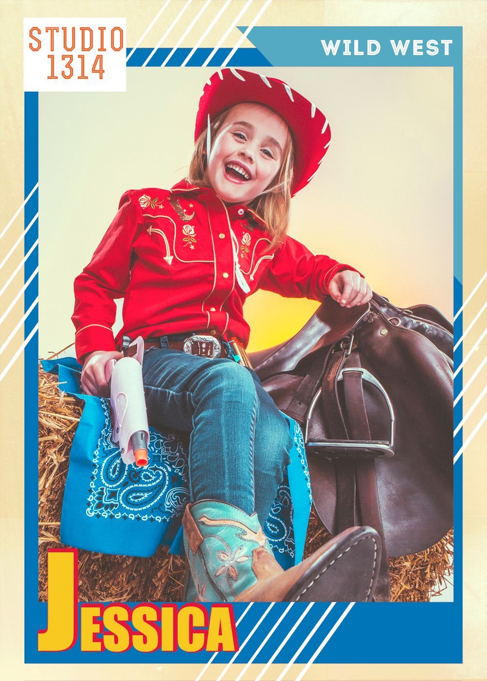 A little girl dressed as a cowboy is sitting on a bale of hay.