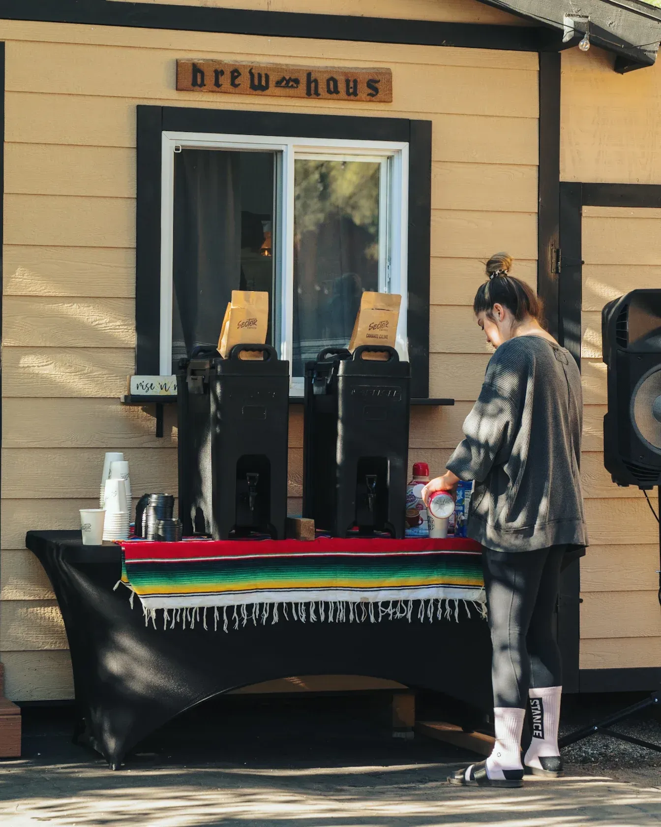 A person prepares coffee at a