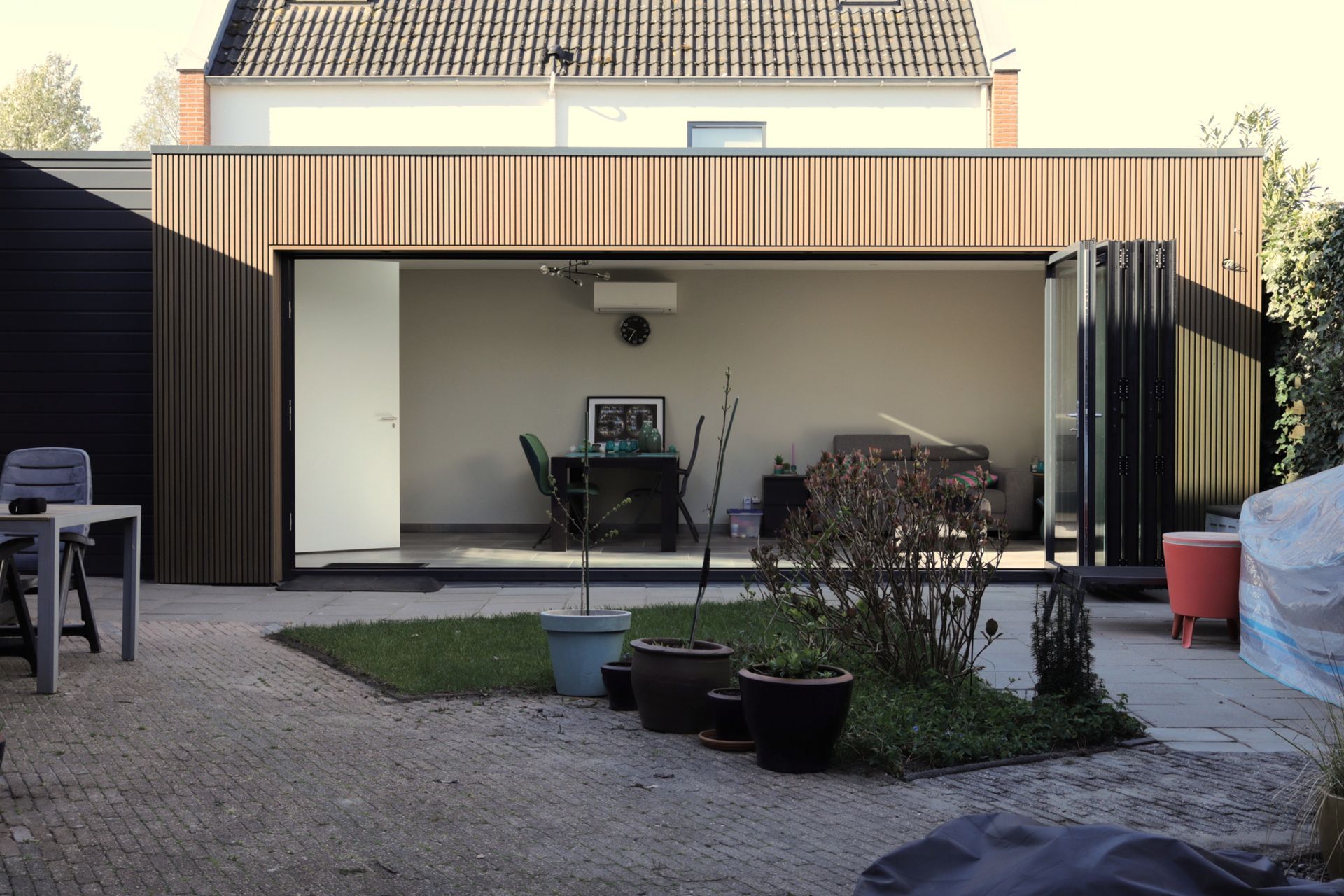 tuinkamer aanbouw hout tuin uitbreiding woning 