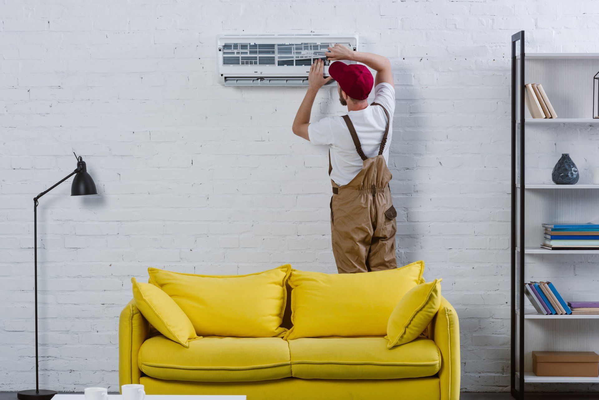 technician repairing the AC