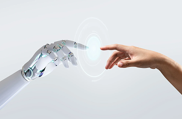 Robotic hand reaching toward a human hand against a light gray background