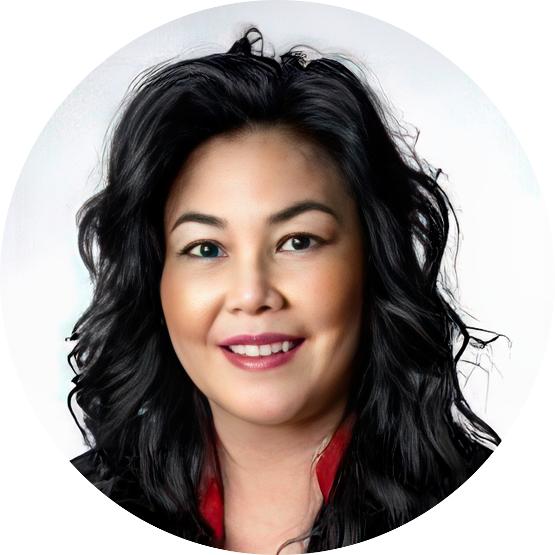 Studio headshot of a smiling woman with wavy black hair on a white background
