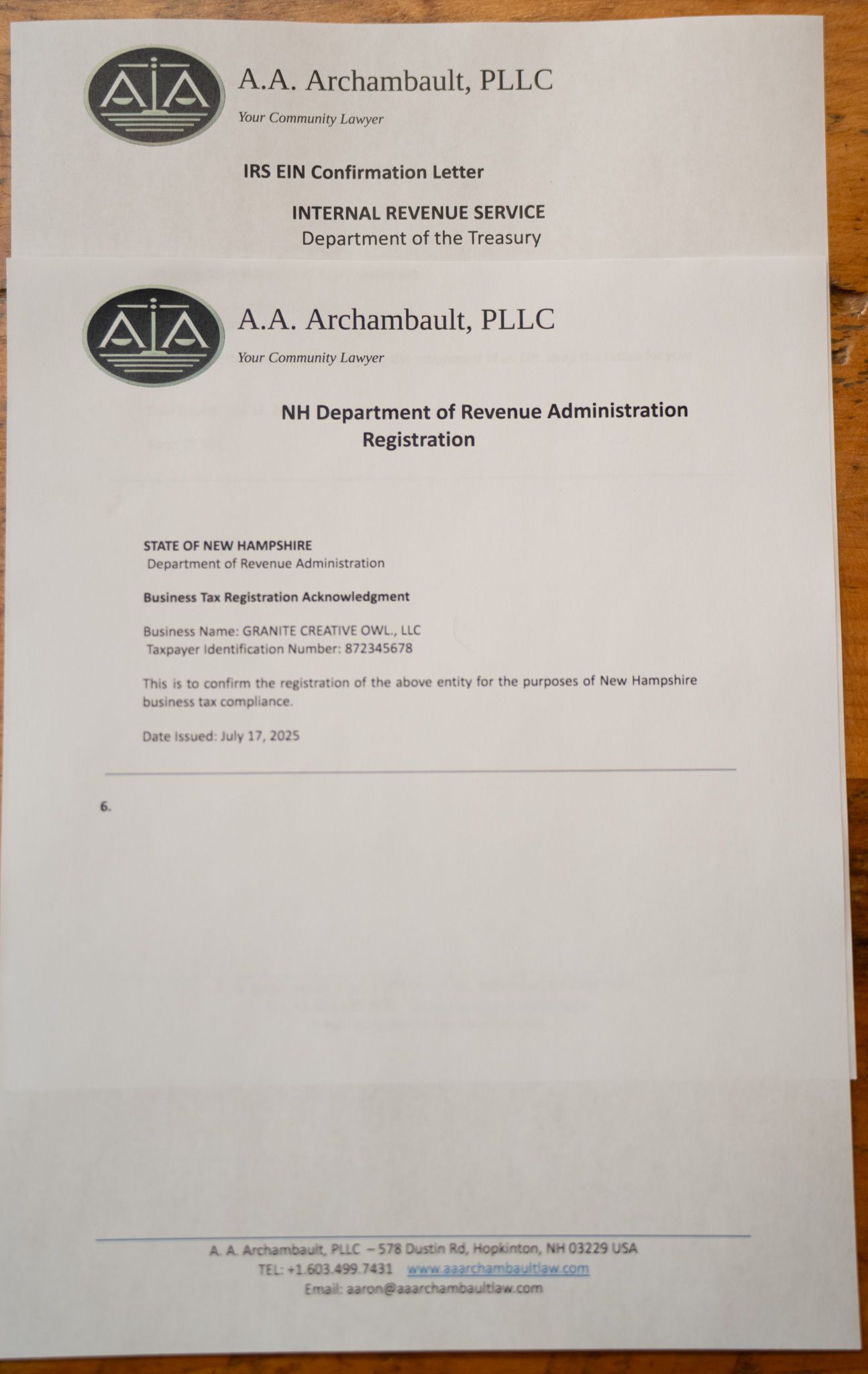 Blurry photo of a printed letter with two ADA logos and text on white paper.