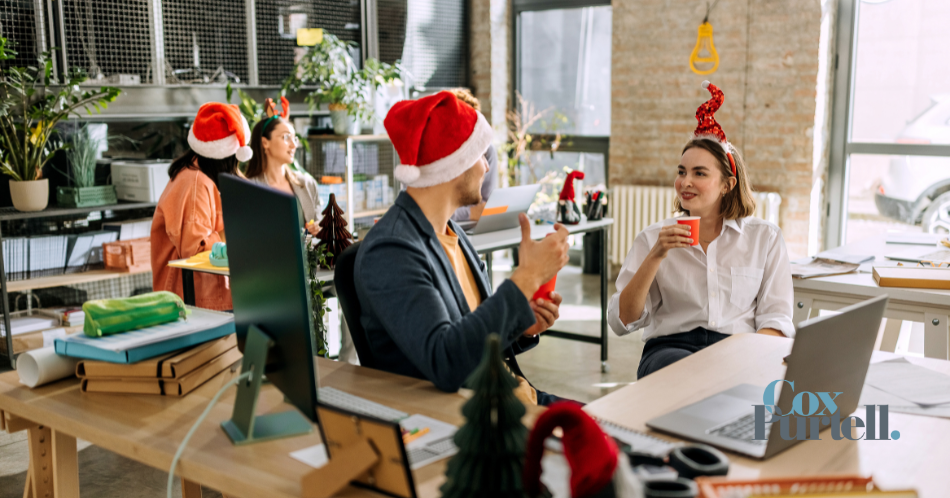 office workers in Christmas Hats
