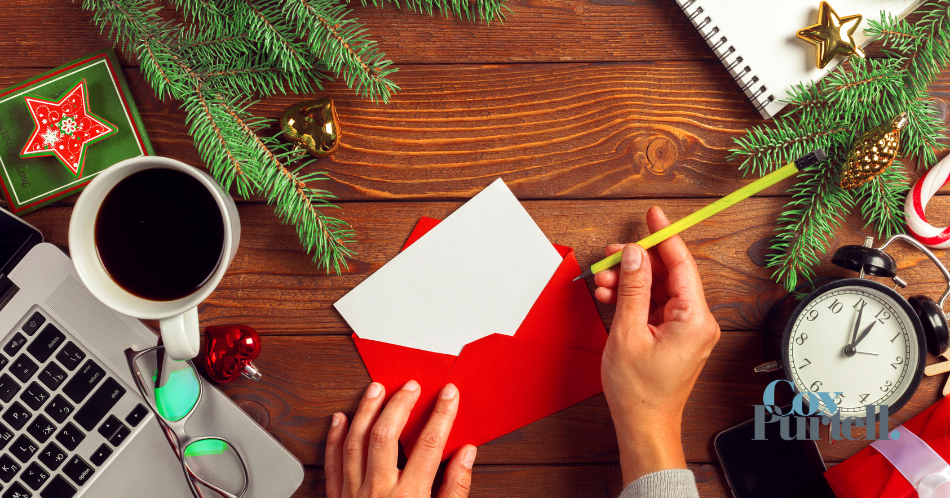 Red envelope with Christmas décor surrounding it