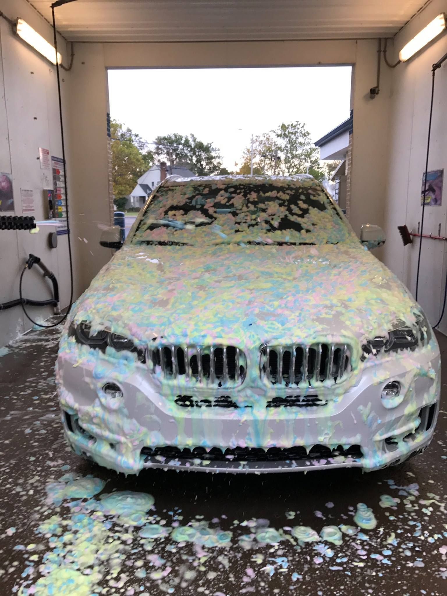 ez wash auto spa self serve wash bay car covered in trifoam