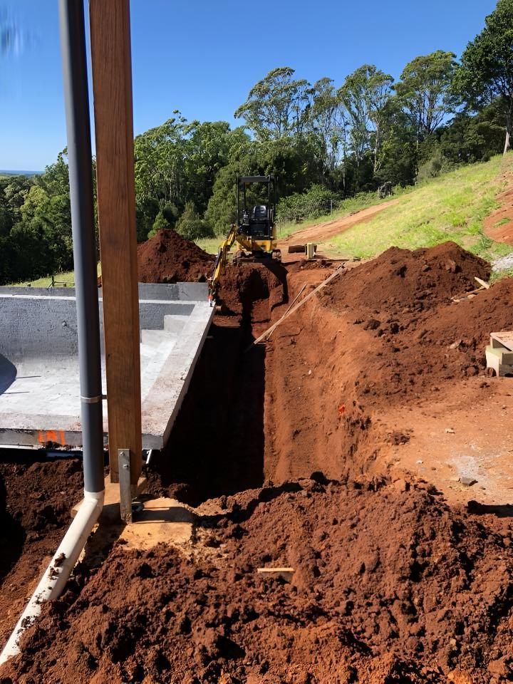 A Construction Site With a Lot of Dirt and Trees in the Background — Limited Access Excavation In Tweed Heads, NSW
