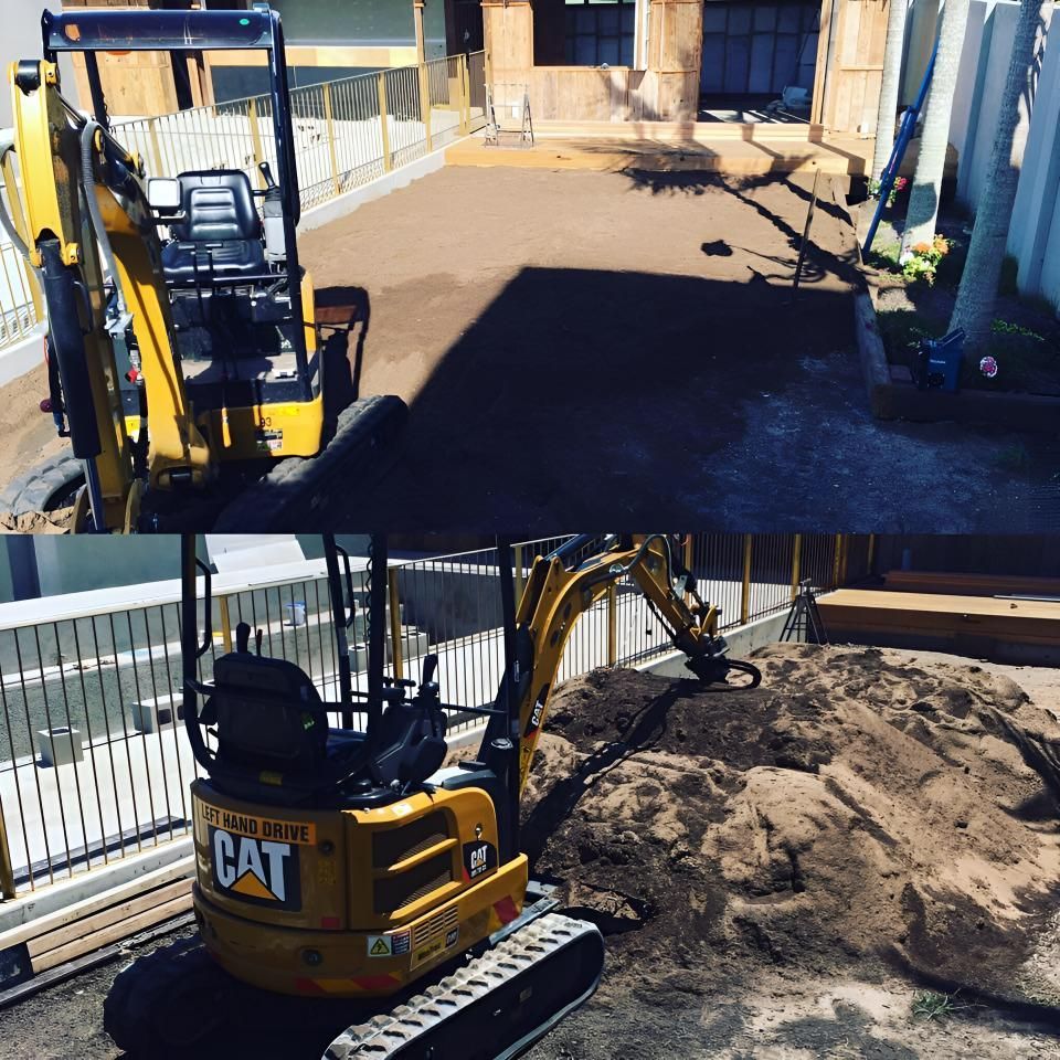 A Yellow Cat Excavator Sits in Front of a House — Limited Access Excavation In Suffolk Park, NSW