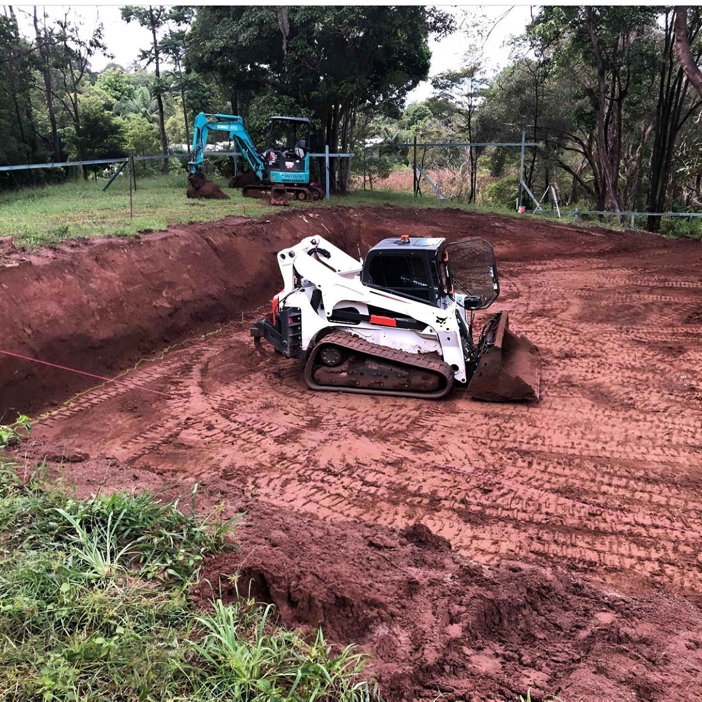 A Bulldozer is Digging a Hole in the Dirt — Limited Access Excavation In Murwillumbah, NSW