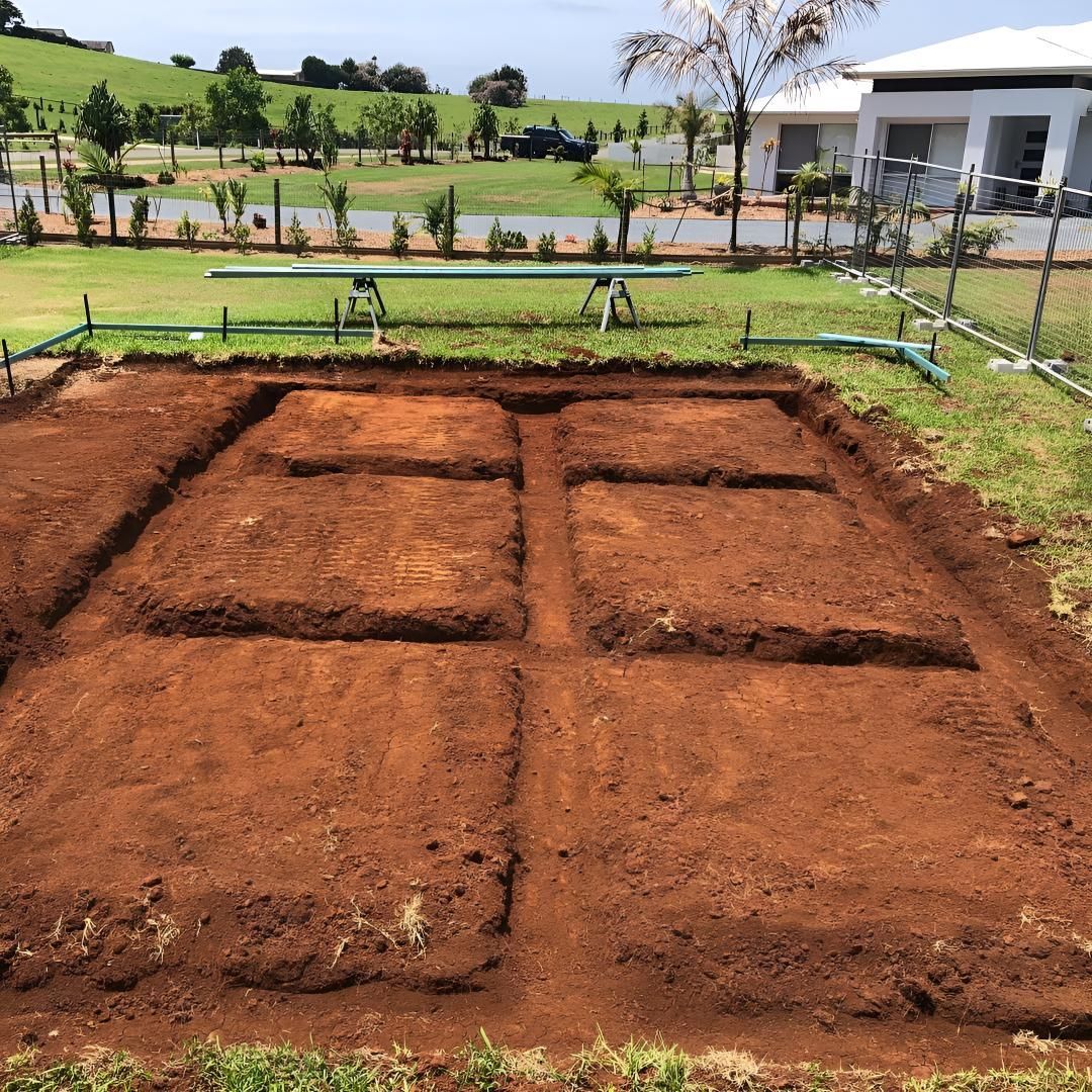 A Large Pile of Dirt With the Letter E on It — Limited Access Excavation In Lismore, NSW