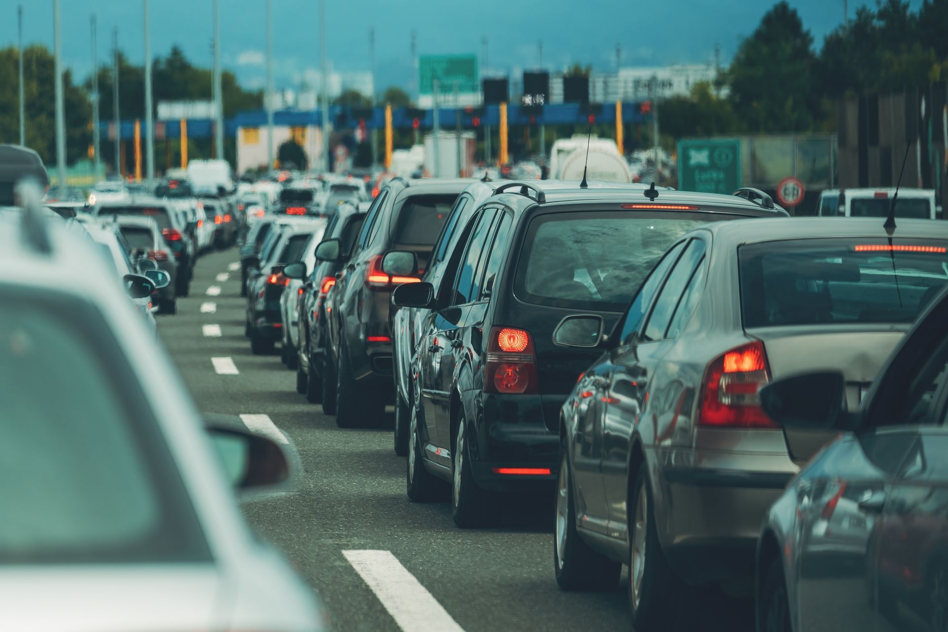 Heavy traffic jam on a multi-lane road, with rows of cars stopped or moving slowly.