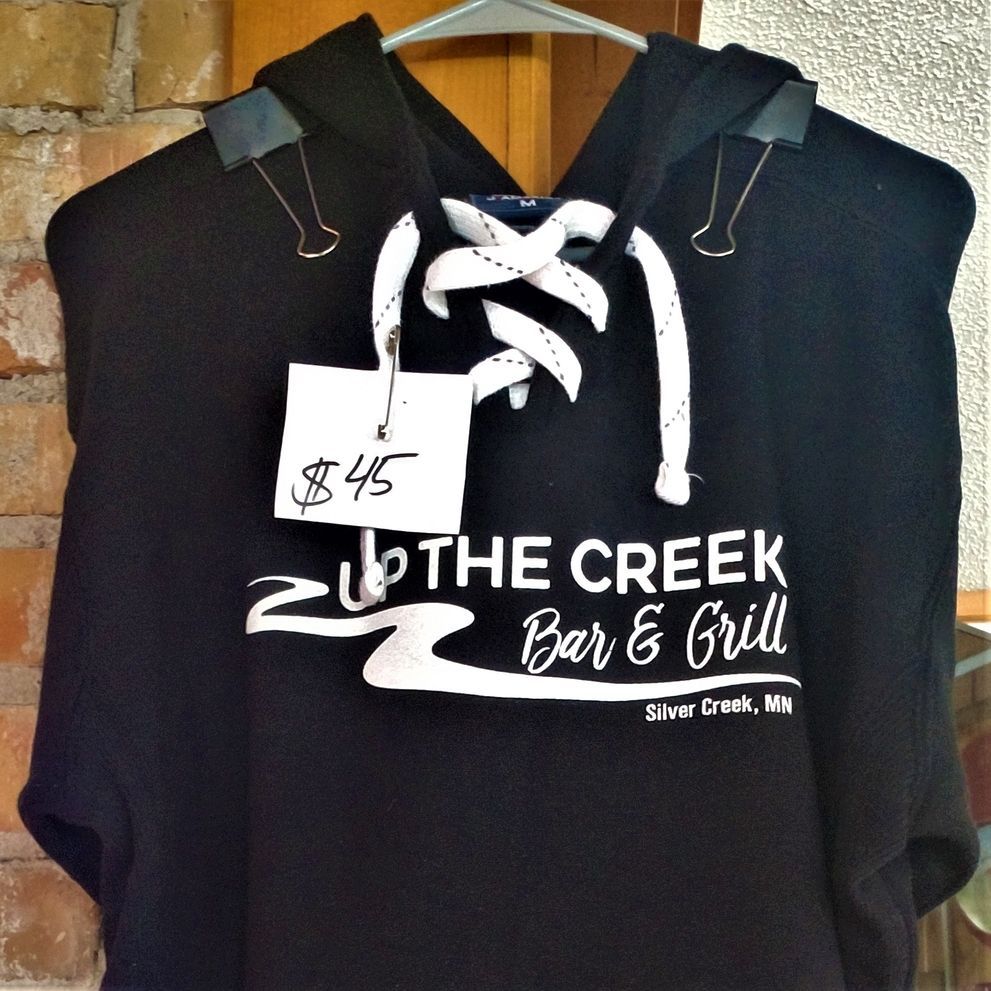 A black hoodie that says the creek bar & grill