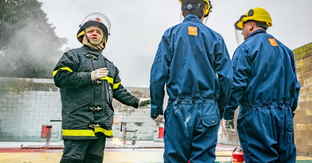 Irish employees attending a workplace health and safety briefing