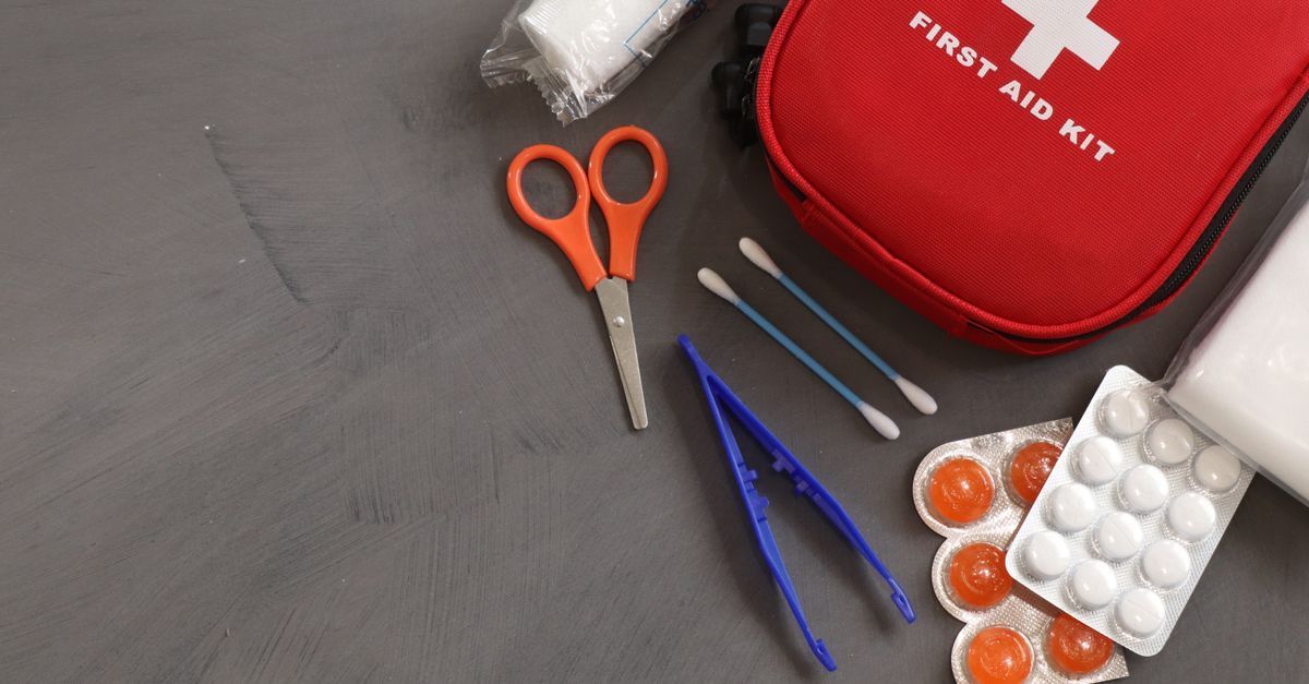 Workplace supervisor checking first aid equipment