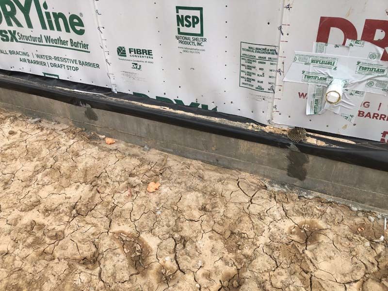 A wall with dryline nsp written on it