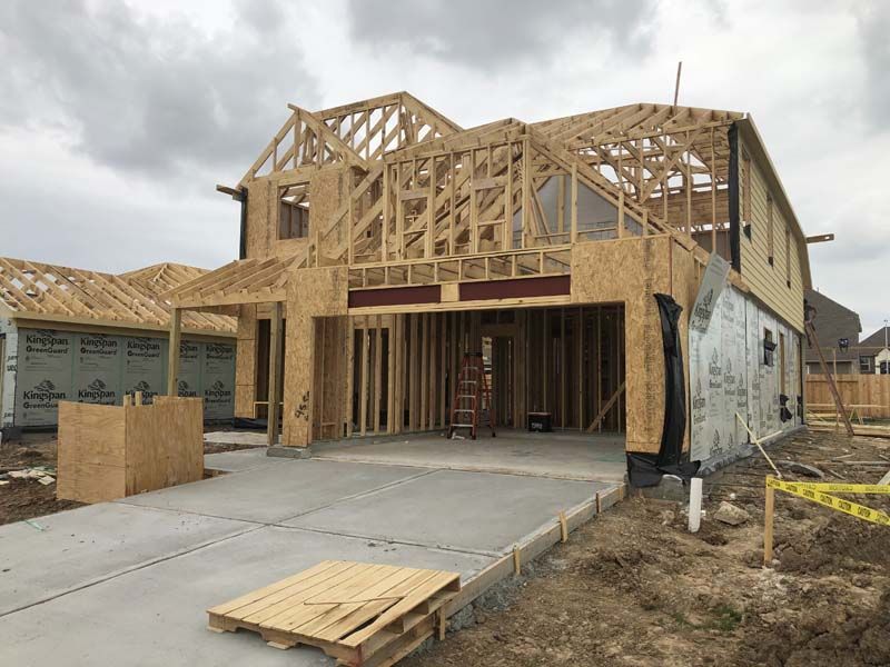A house is being built with a wooden frame.