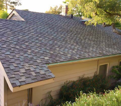 A house with a roof that is covered in shingles.