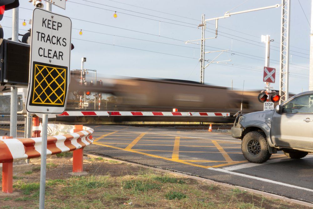 Loaded Coal Train Speeding Through A Railway Level Crossing - Glass & Aluminum In Moranbah, QLD