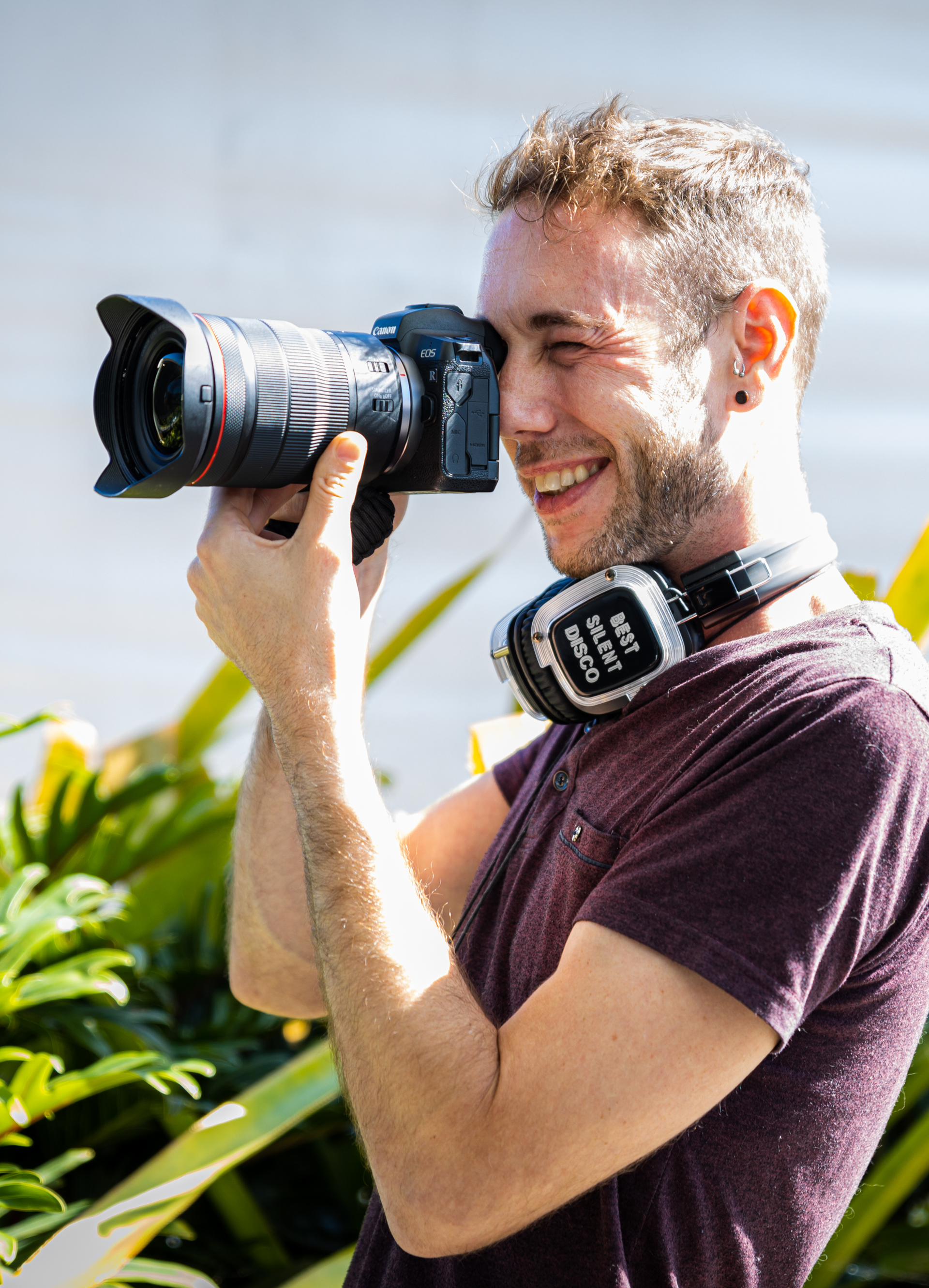 Bjoern Schmal taking a picture with a camera .
