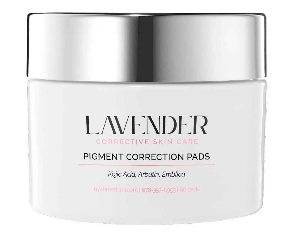 White jar of Lavender Skin pigment correction pads with silver lid and pink text.