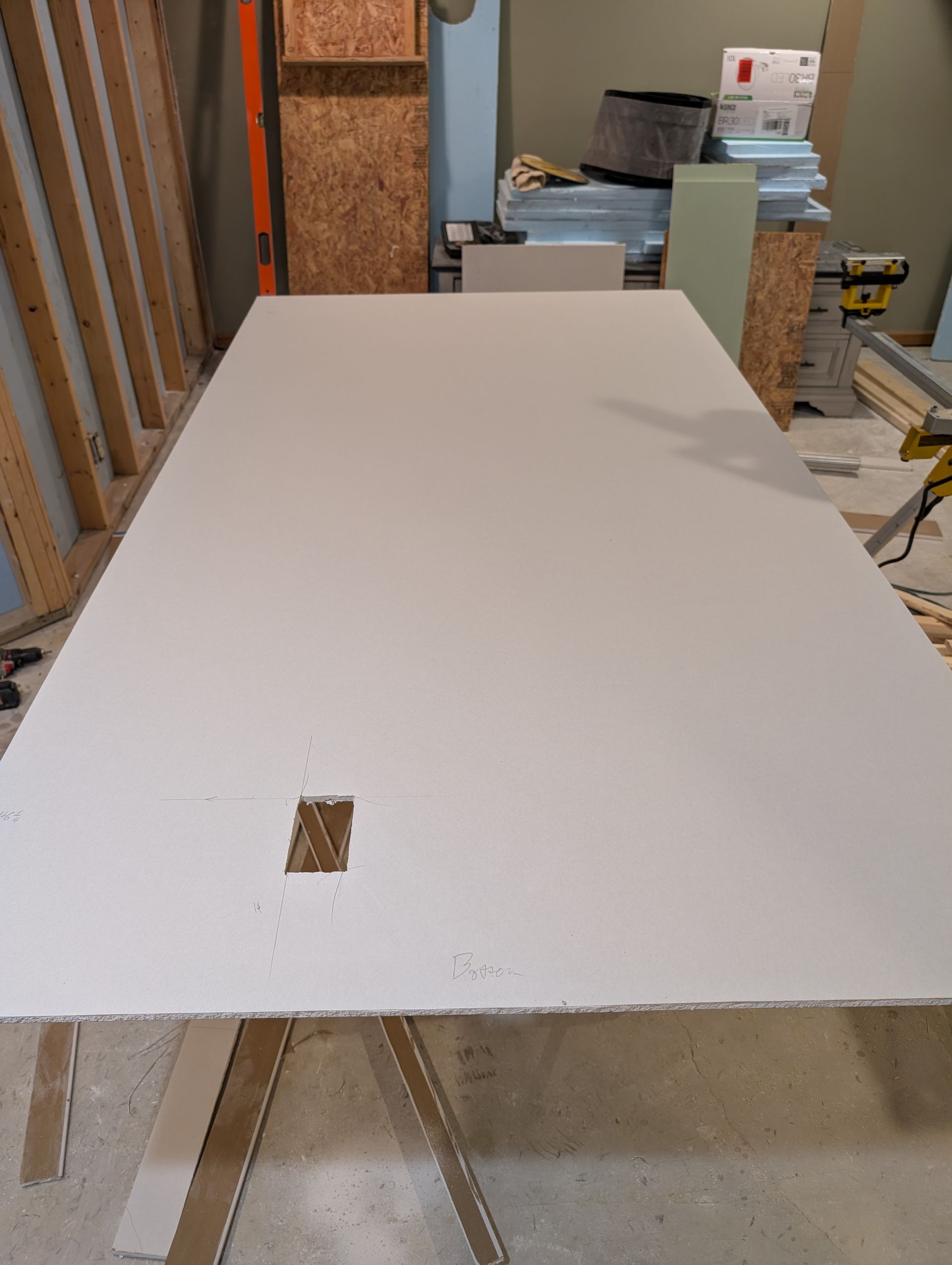 Wall board with hole for electrical outlet