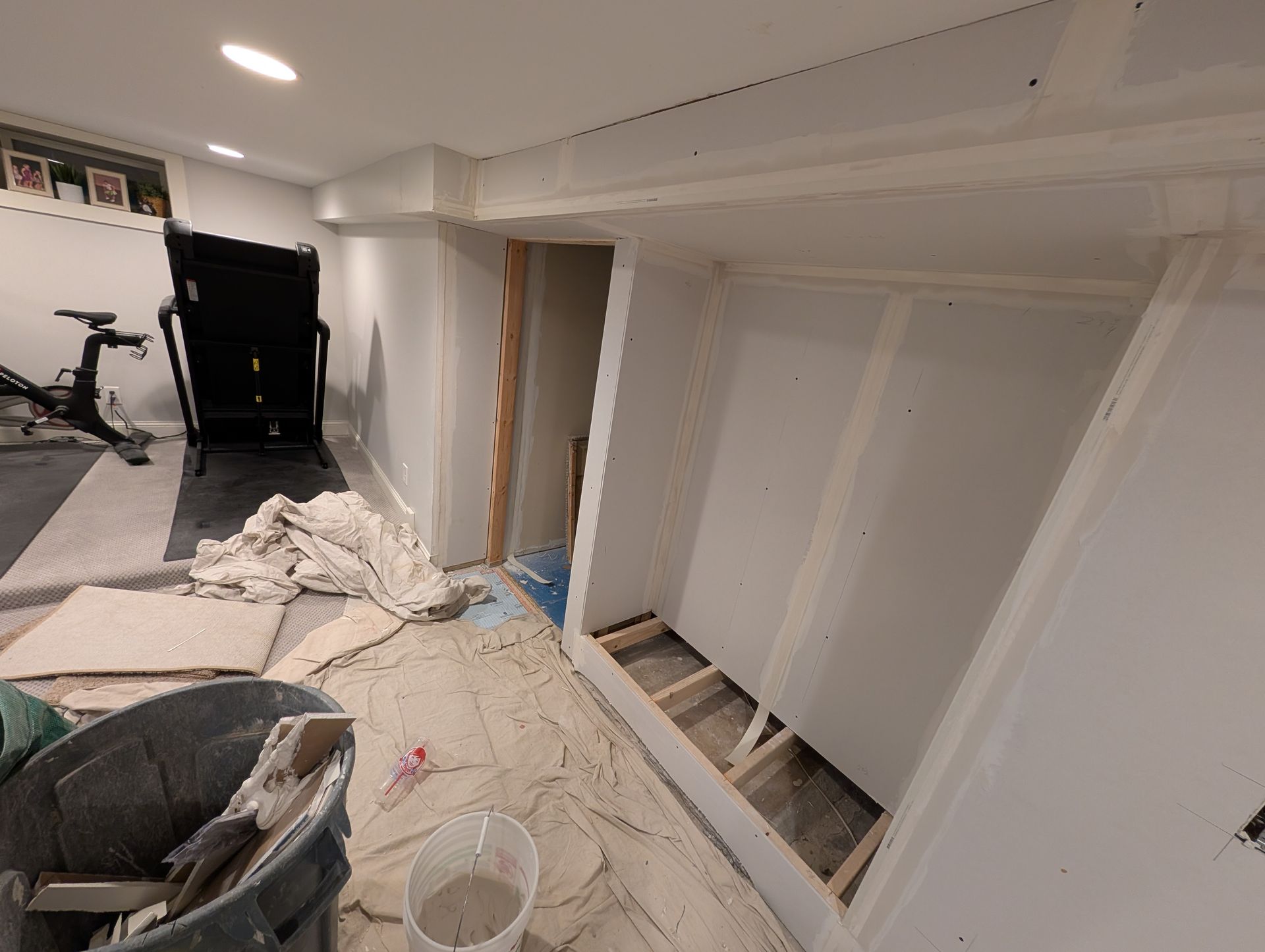 Remodeled TV wall niche in a St. Paul home with new drywall finishing and an enlarged recessed opening to accommodate a larger television.