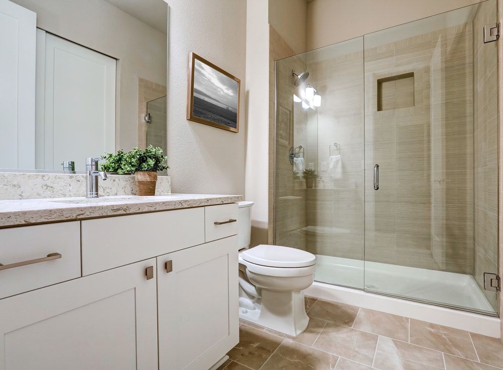 A Bathroom with A Toilet , Sink , Mirror and Walk in Shower — JWB Joinery in Aitkenvale, QLD