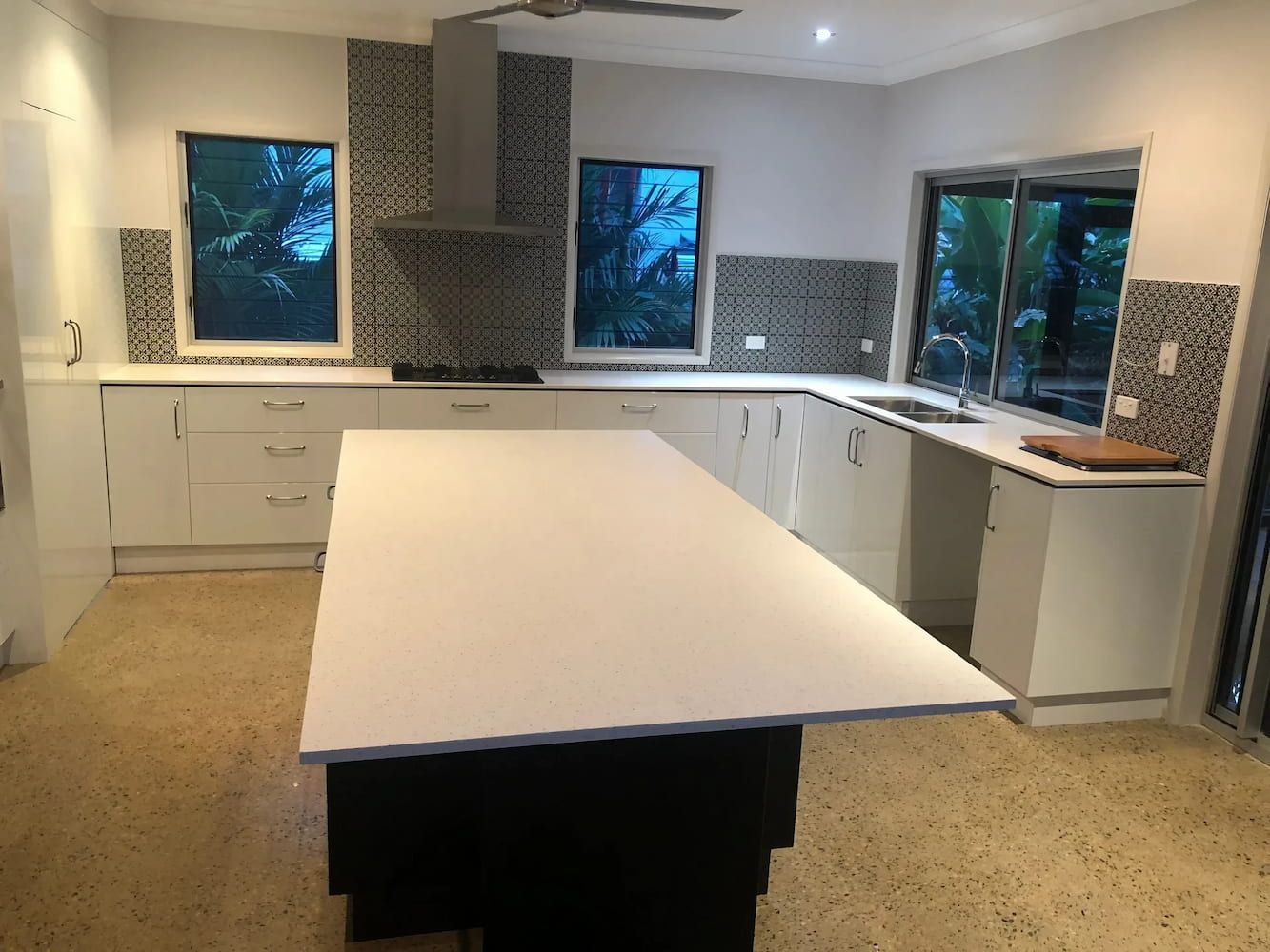 A Kitchen with White Cabinets and A Large Island — JWB Joinery in Aitkenvale, QLD