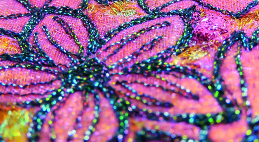 close up of floral free machine embroidery by claire fell