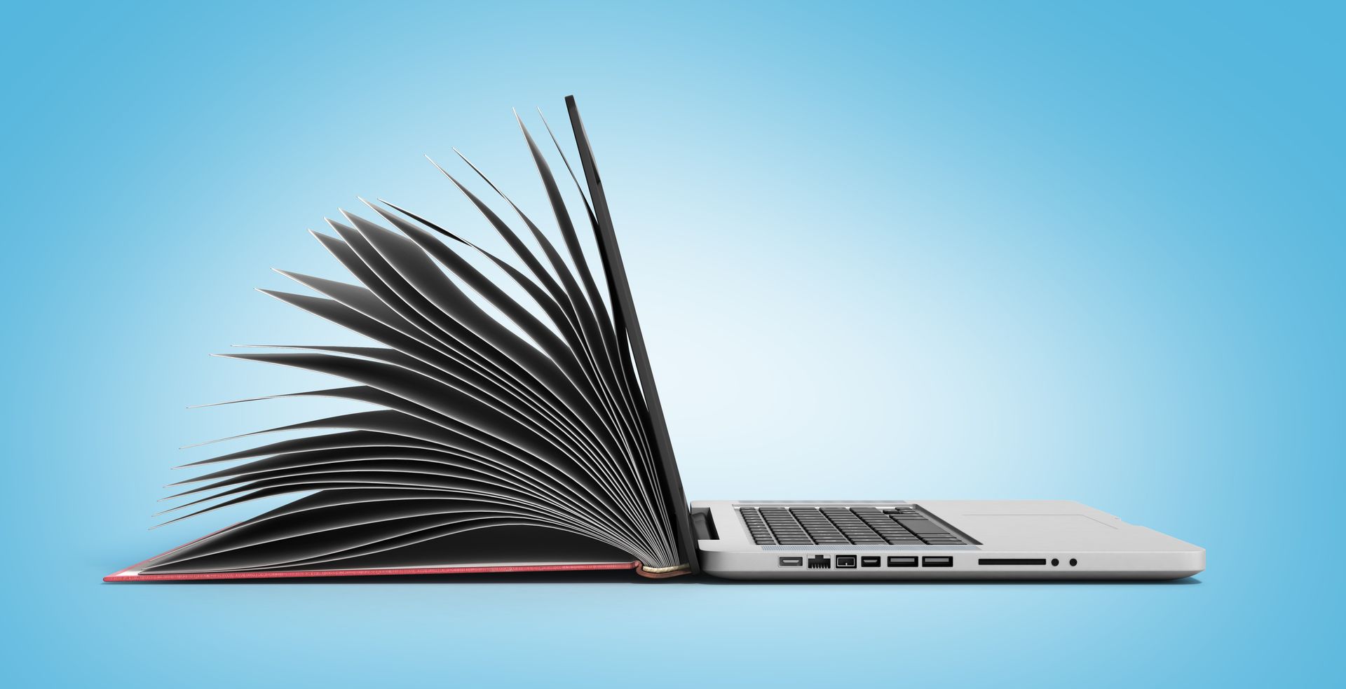 Un ordinateur portable est transformé en livre sur un fond bleu