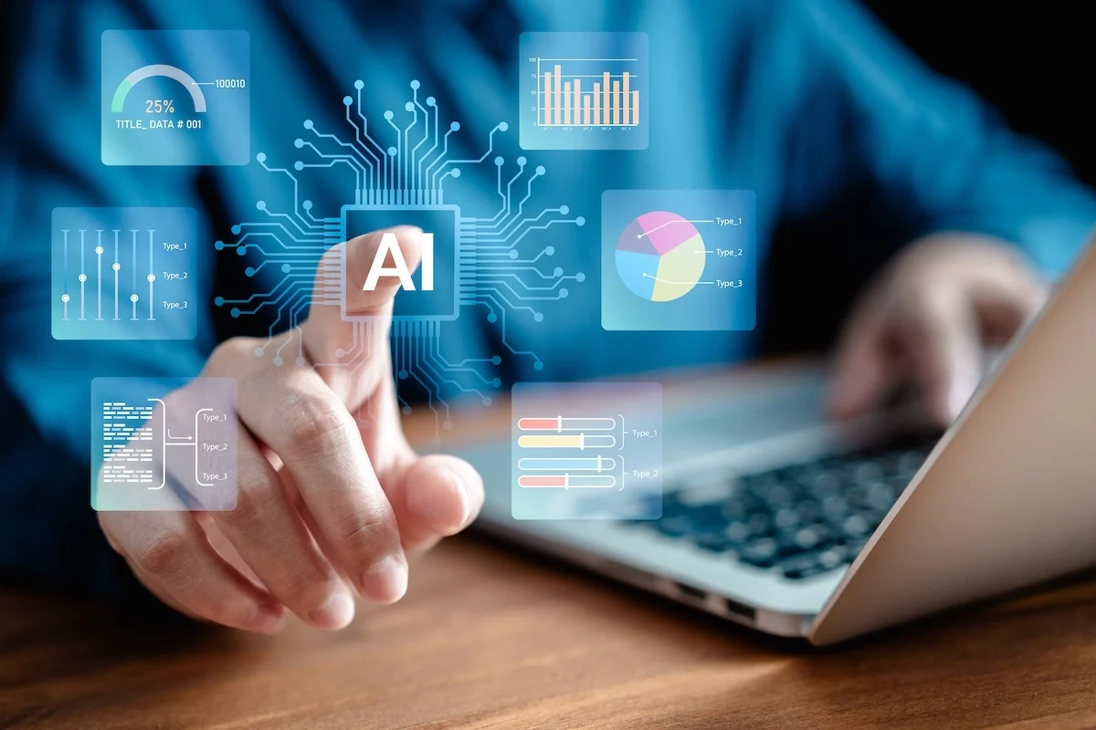 Une personne tend la main pour toucher une icône lumineuse de processeur d'IA numérique entourée de graphiques et d'analyses de données sur un ordinateur portable.