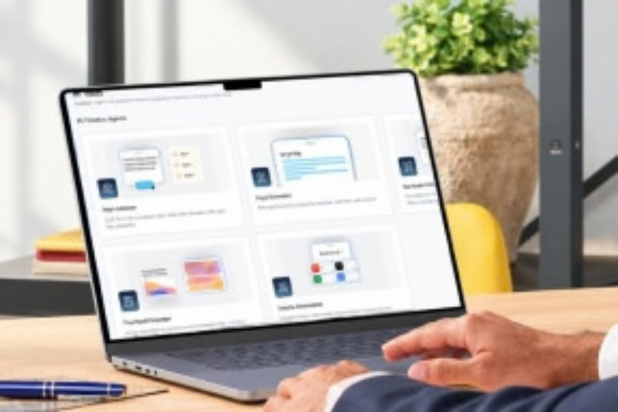 Person using a laptop with a web design dashboard on screen at a desk