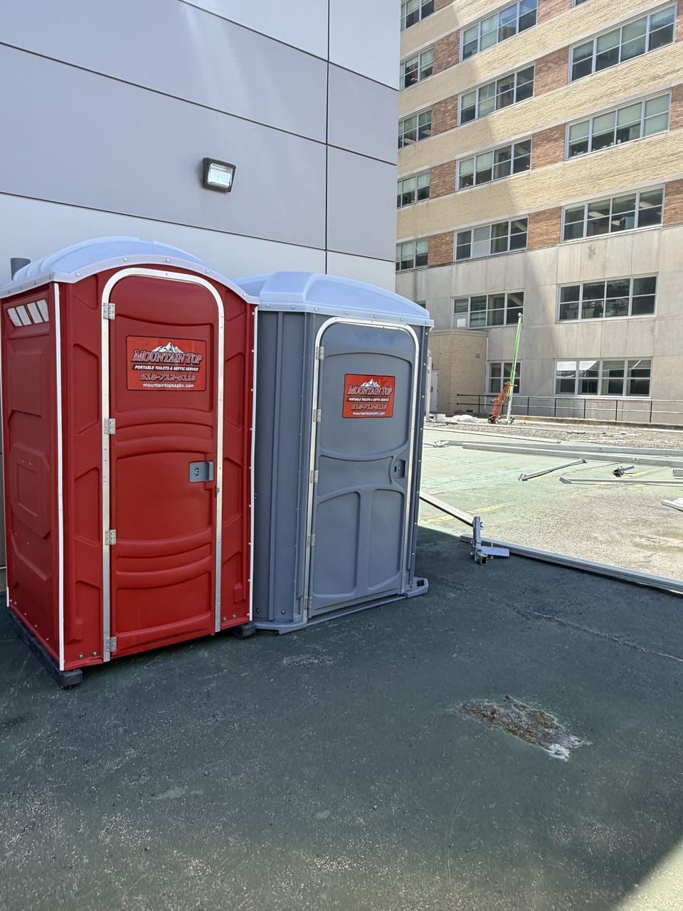 Row of Red Portable Toilets