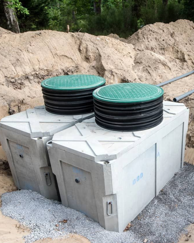 Two tanks with green and black lids