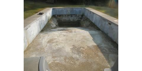 Empty concrete swimming pool, view from above.