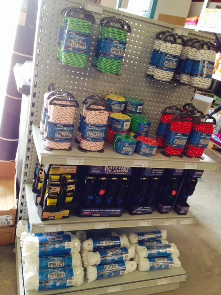 A store shelf filled with rolls of toilet paper