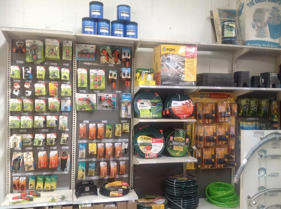 A store filled with lots of gardening supplies including a hose