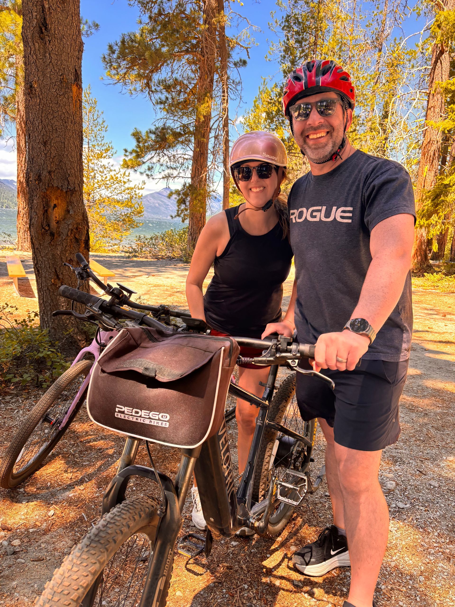 A group of people are riding bikes in the woods.