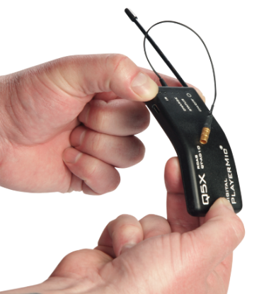 Hands bending a Q5X PlayerMic displaying its flexible rubber housing for player and talent safety