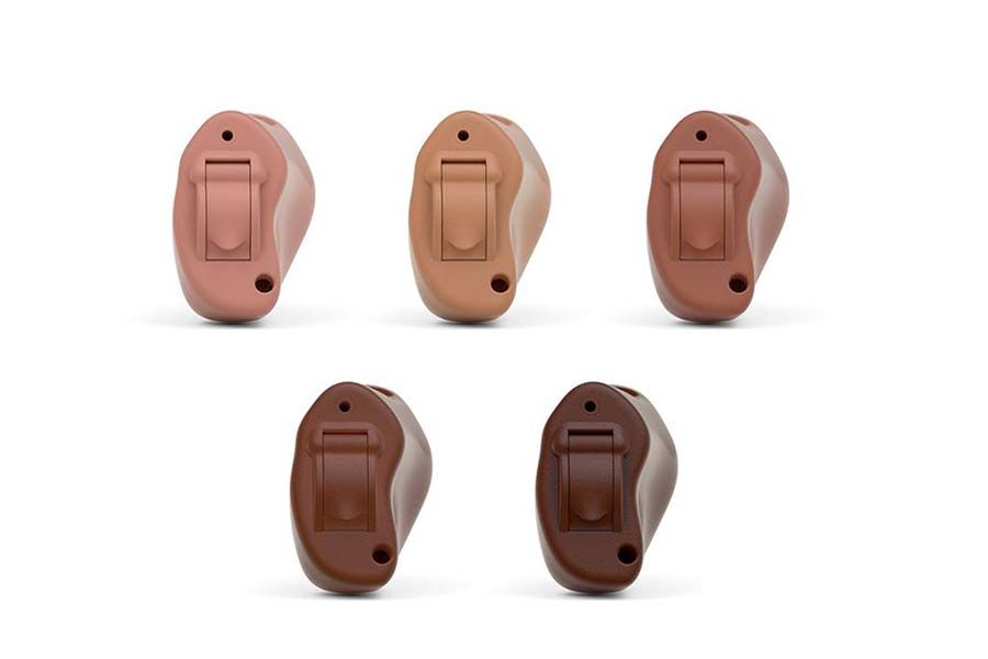 Lineup of NESO 2.4 in-ear receivers shown in 5 different flesh tones ranging from light to dark brown