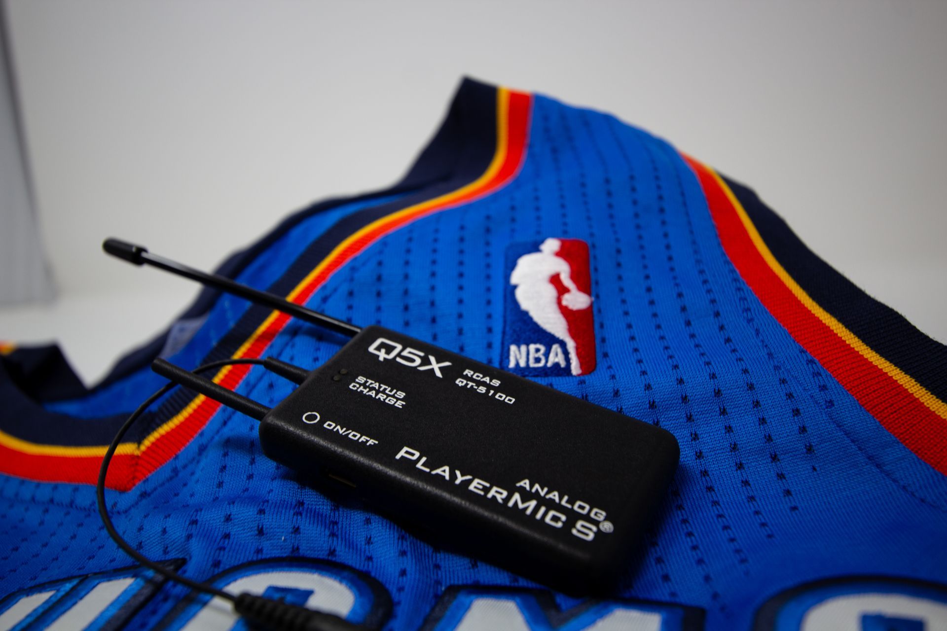 Q5X PlayerMic S sitting on NBA jersey