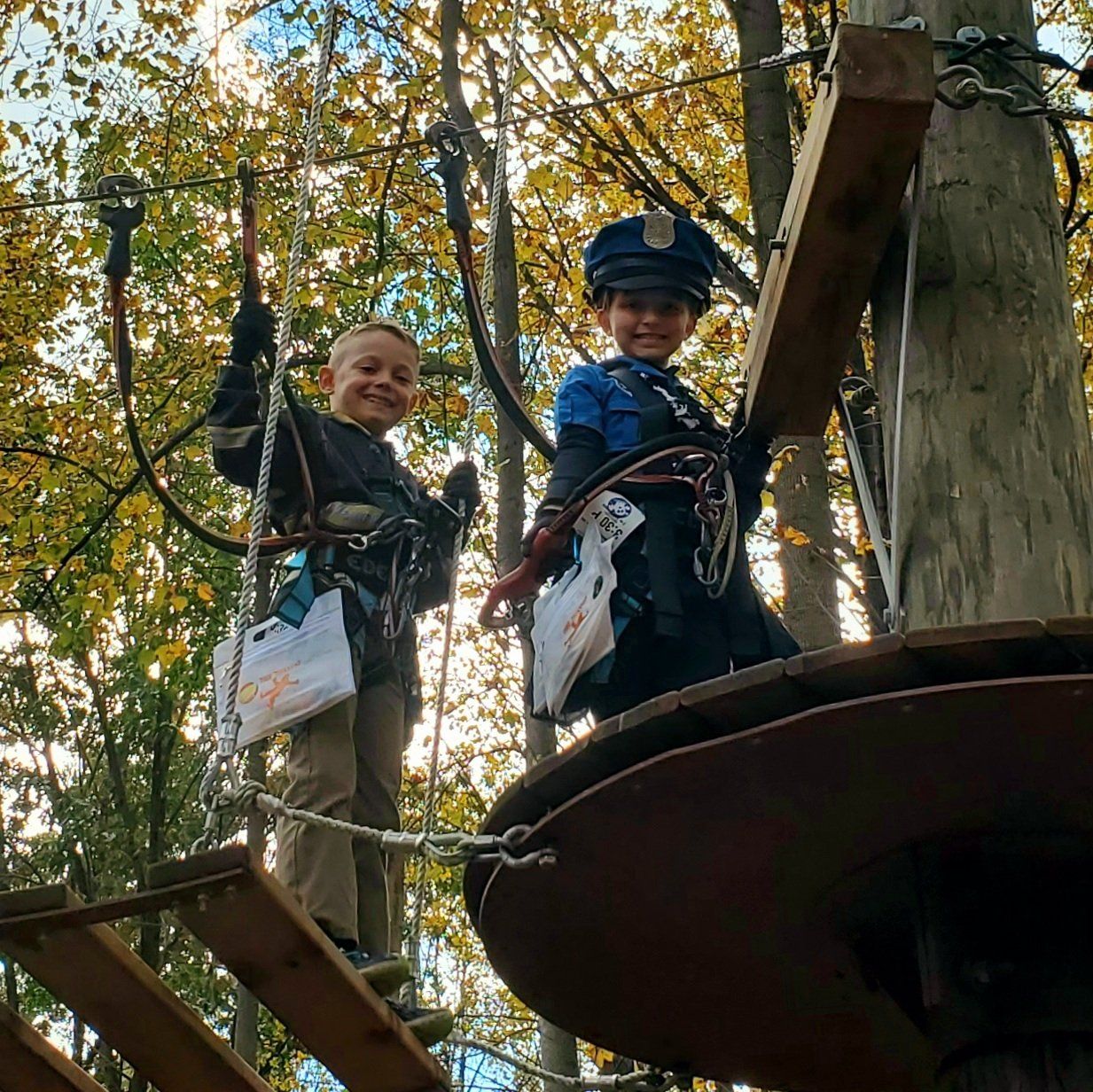 Young children climbing dressed up for Halloween