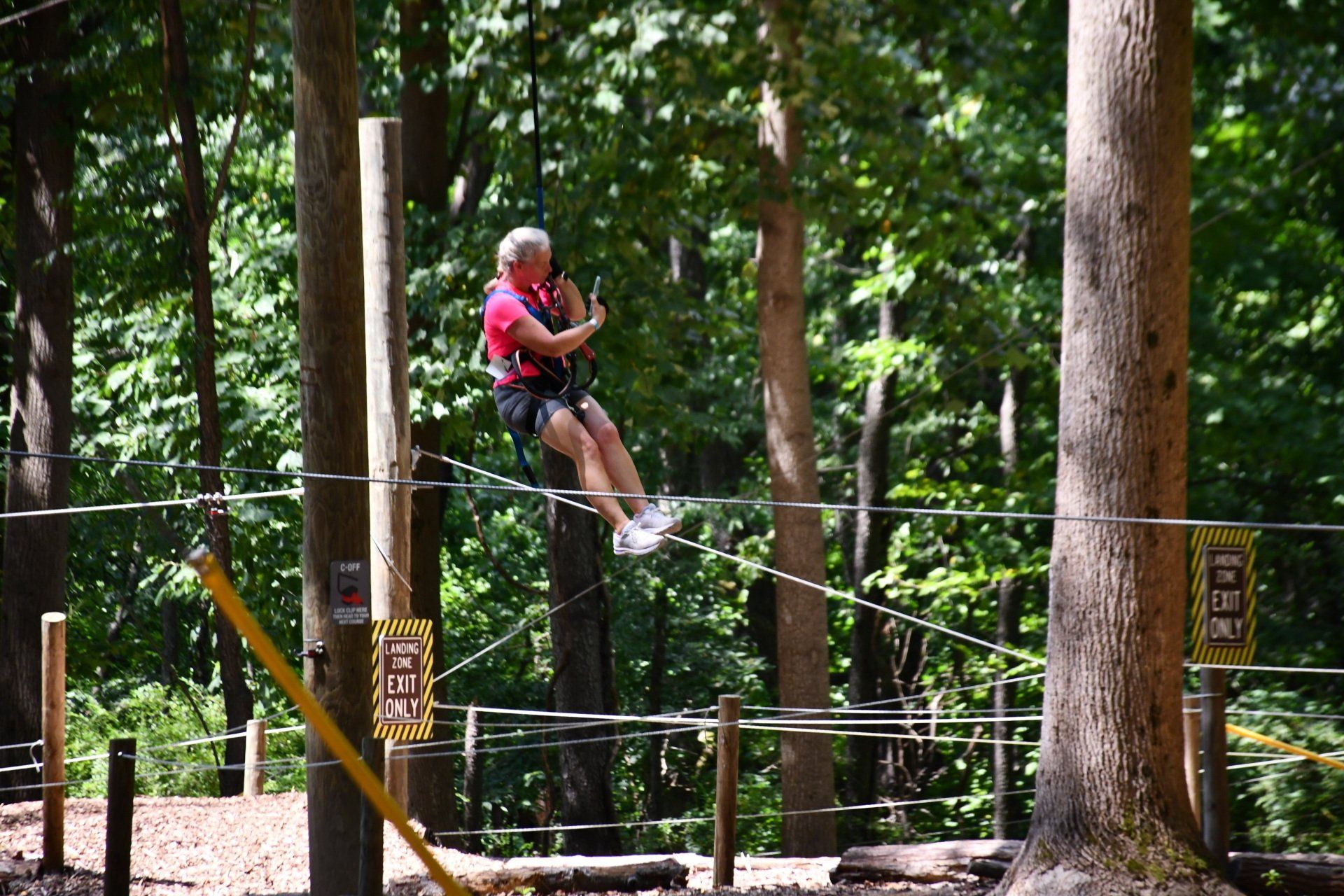 Young girl on Tru blue trustfall at ropes course