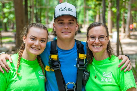 A family of staff enjoying their job at Tree Trekkers