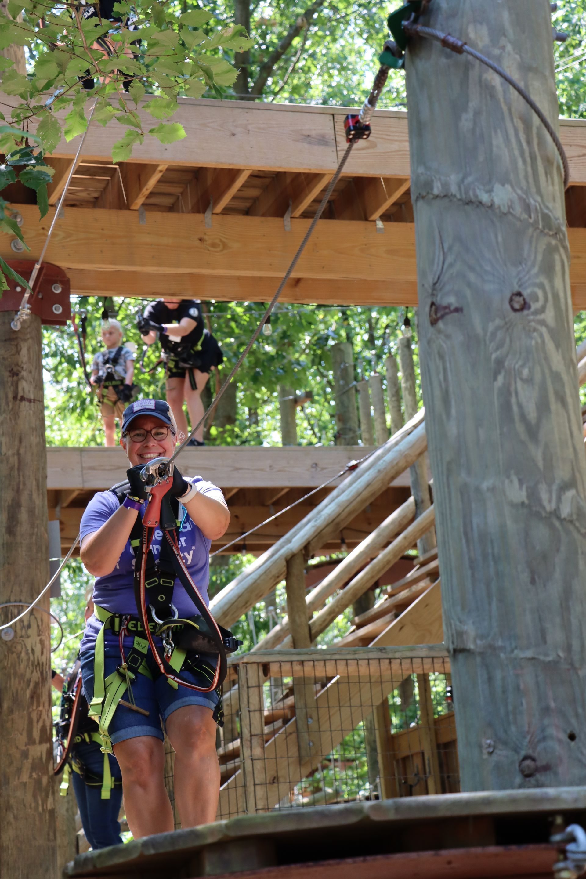 Woman on highropes course at tree trekkers